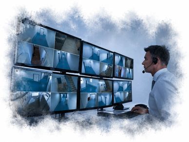 Man monitoring multiple security camera feeds in a control room.