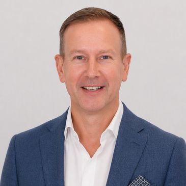Professional man in a blue suit smiling