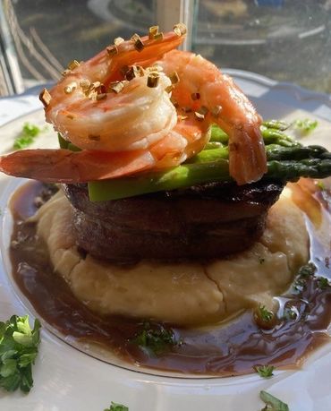 Burnside's steak Oscar with filet mignon, asparagus, grilled shrimp and mashed potatoes