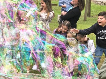 Children love popping bubbles. and they make giant soap bubbles with Grandpop Bubbles, GPOPB.