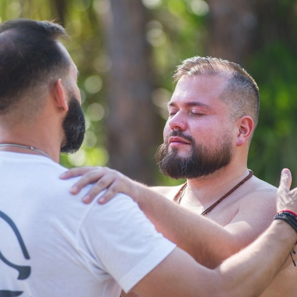 Wolfpack Brotherhood, men embracing
