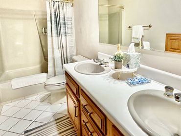 Double vanity bathroom of a vacation rental in Janesville, WI decorated by the MDR Design Team