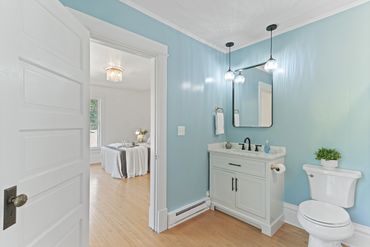 Primary bedroom ensuite of 1890s home restored in Janesville, WI by MDR Design Co.
