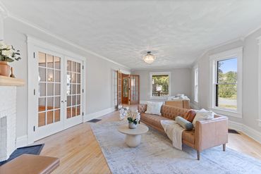 Parlor/Grand Room of 1890s home restored in Janesville, WI by MDR Design Co.
