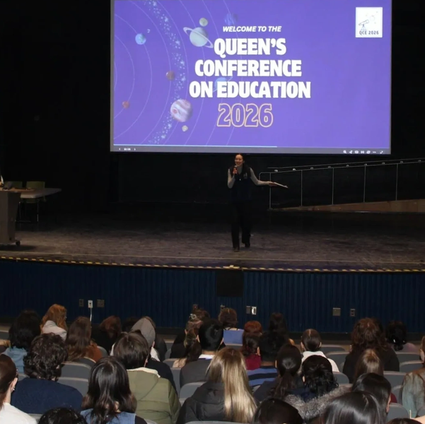 Speaker addressing audience at Queen's Conference on Education 2026.