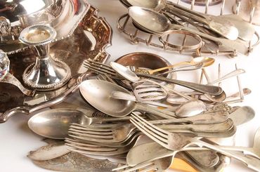 Collection of sterling silver flatware World Gem Labs buys and appraised.