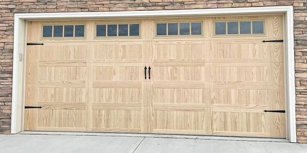 Wooden garage door with window panels.
