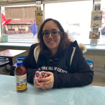 Young women sitting at counter will diet Snapple