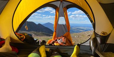 View of the Rocky Mountains from inside tent.