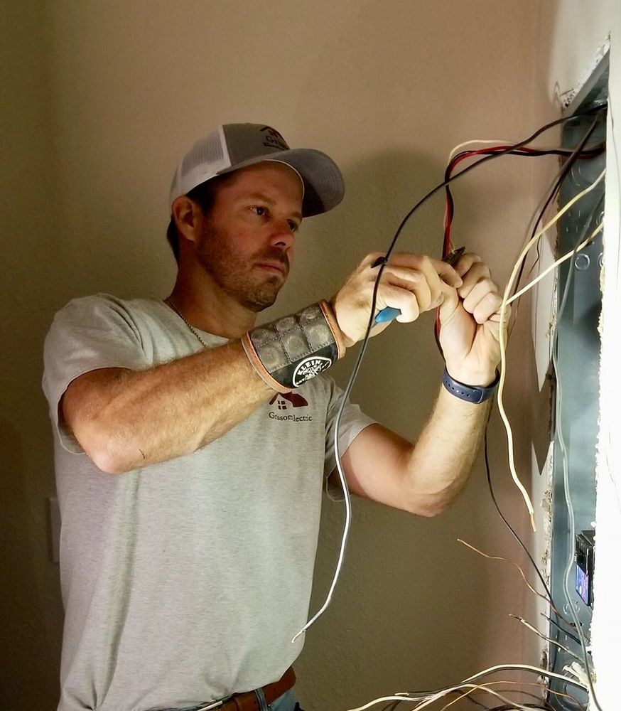 A man at work, representing Grissom Electric Service LLC's electrical services in Clarksville, TN