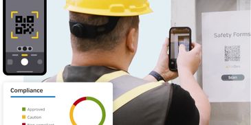 Worker scans a QR code on safety forms using a smartphone for compliance tracking.