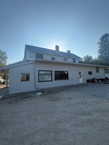 Exterior of Giumenti General Store Feed & Supply building on a clear day.