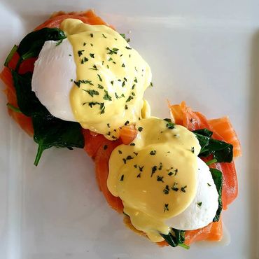 Two pancakes with a generous scoop of vanilla ice cream