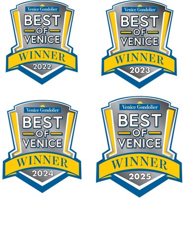 A scenic landscape featuring mountains, a lake, and a clear blue sky.