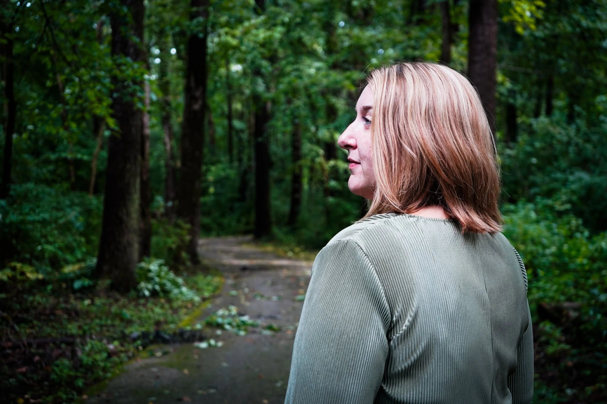 Wellness professional grounding in nature with sound healing