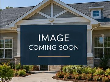 A house with a sign saying 'Image Coming Soon' in front.