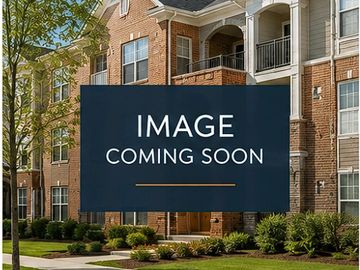 Apartment building exterior with landscaping and 'Image Coming Soon' sign.