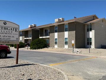 Exterior view of Southgate Village Apartments on a sunny day.