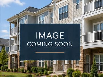 Placeholder image with 'Image Coming Soon' text over a residential building background.