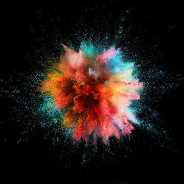 Colorful powder explosion in black background.