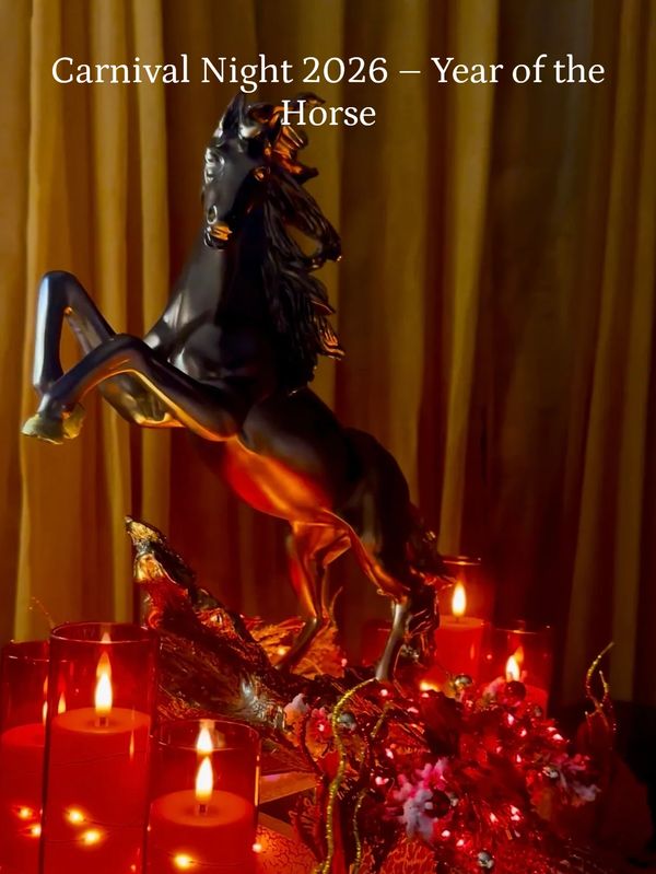 Black horse statue surrounded by red candles and decorations for Carnival Night 2026.