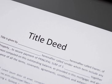 Close-up of "Title Deed" document.