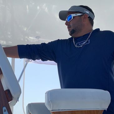 captain chiki spotting the flying marlin in the horizon