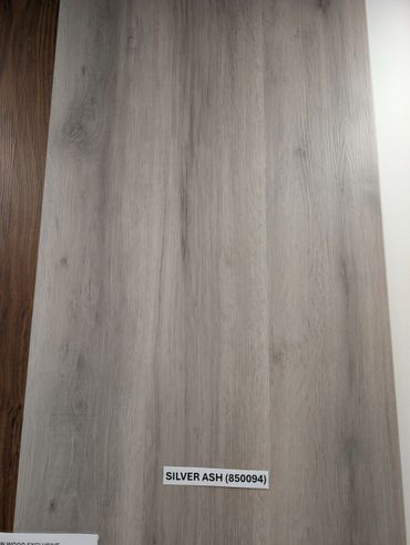 Wooden panel labeled Silver Ash with a light gray finish.
