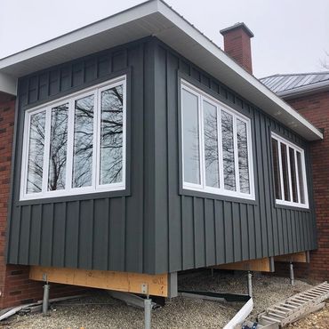Custom built addition, vertical blue siding in Collingwood, Ontario