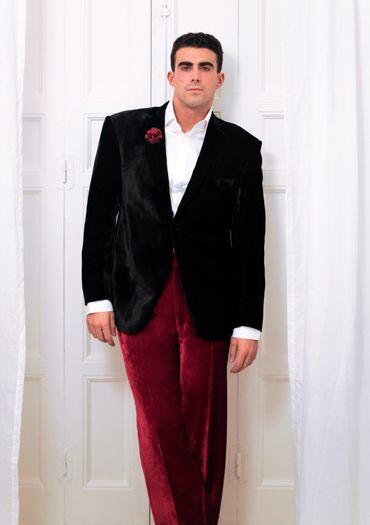 man posing with a flower