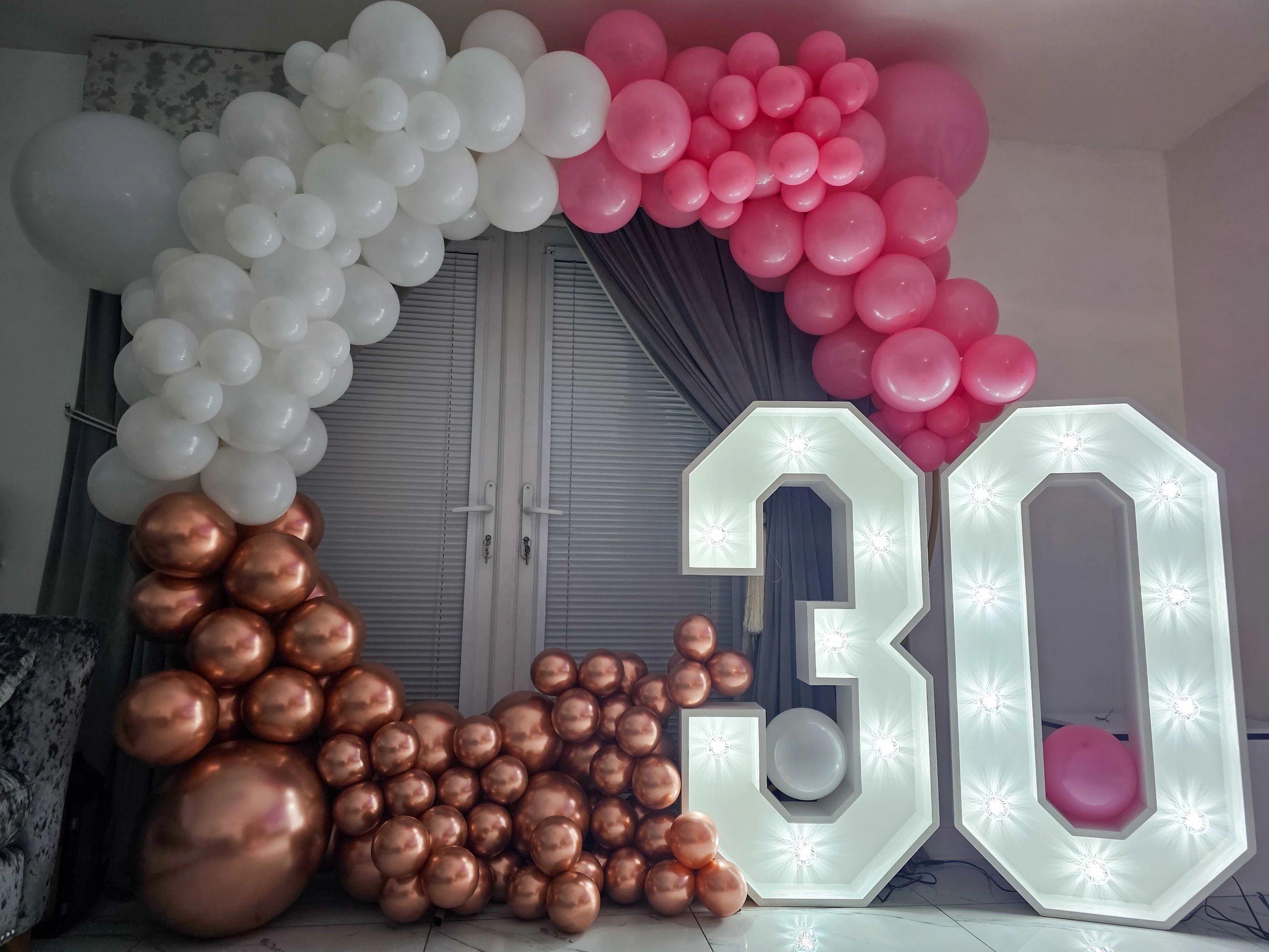 6ft rose gold and white balloon hoop with 4ft light up numbers