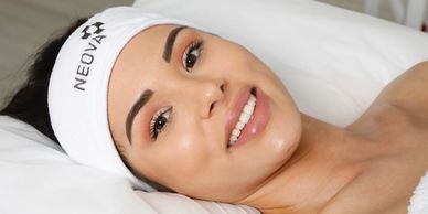 Woman Wearing a Headband While Preparing for a Skin Clearing Acne Facial