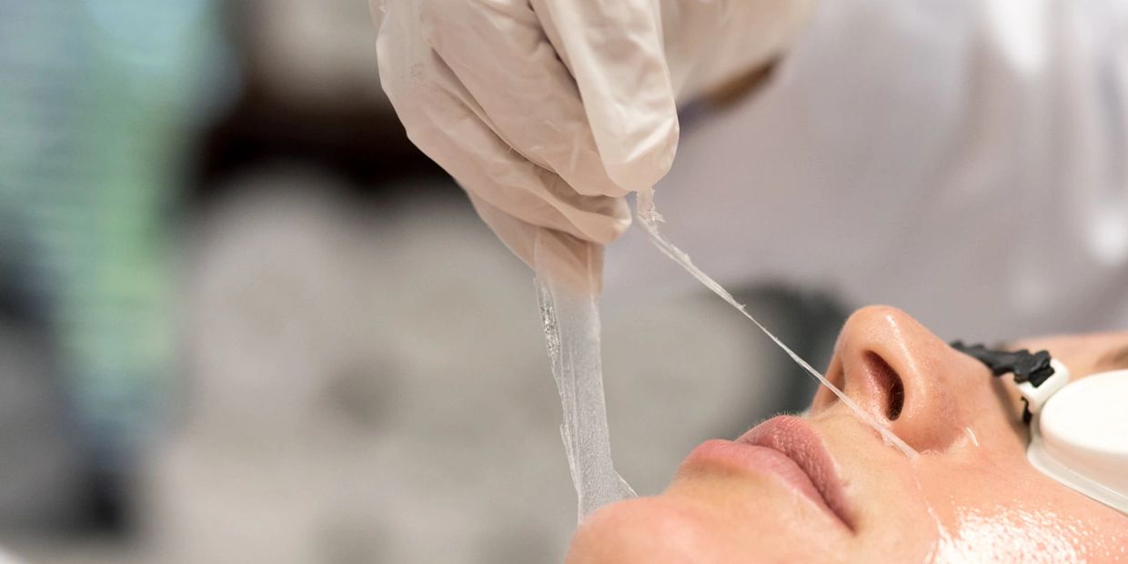 Woman Getting Chemical Peel Removed from Her Face