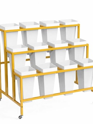 Gold bloom cart with three tiers of white pots on wheels.