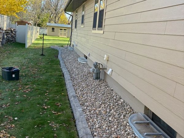 Bullet Edging and River Rock install by HammerTime Landscaping LLC in Winona, MN.