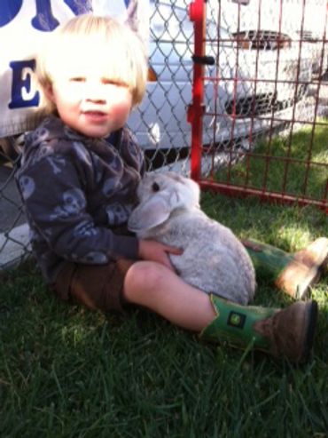 Tawni's son holding a bunny