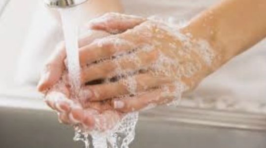 A picture of hands being washed