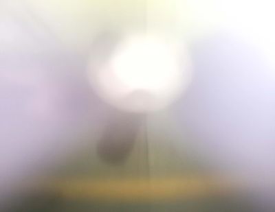 A blur of light and color to depict poor vision.