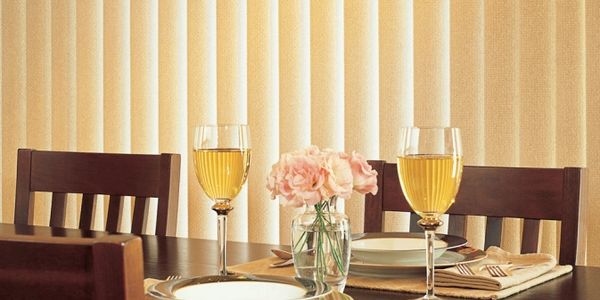 Vertical Blinds, great and affordable window treatments, over a dining room in Panama City Florida
