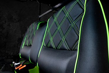 Diamond cross-stitch detailing, with Matched Seat Piping in the Exterior Color of Each Cart.
