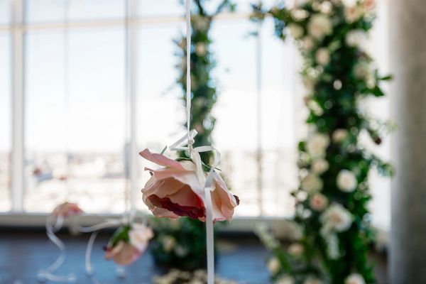 Hanging roses decor at wedding proposal, Hotel X