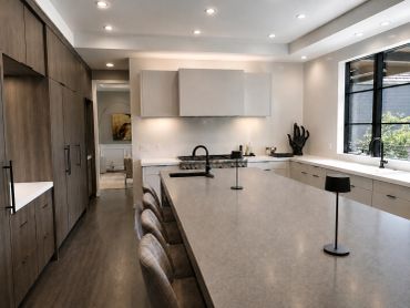 Modern kitchen with large island and sleek cabinetry.
