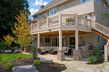 Spacious two-story house with a covered patio and garden.