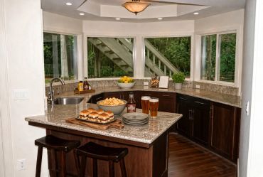 Modern kitchen island with snacks and drinks.