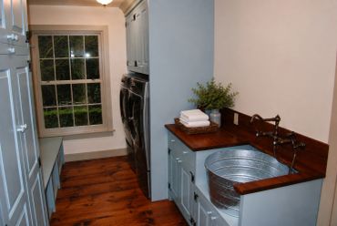 Laundry room with washer, dryer, and utility sink.