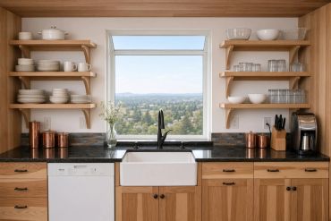 Modern kitchen with open shelves and a window view.