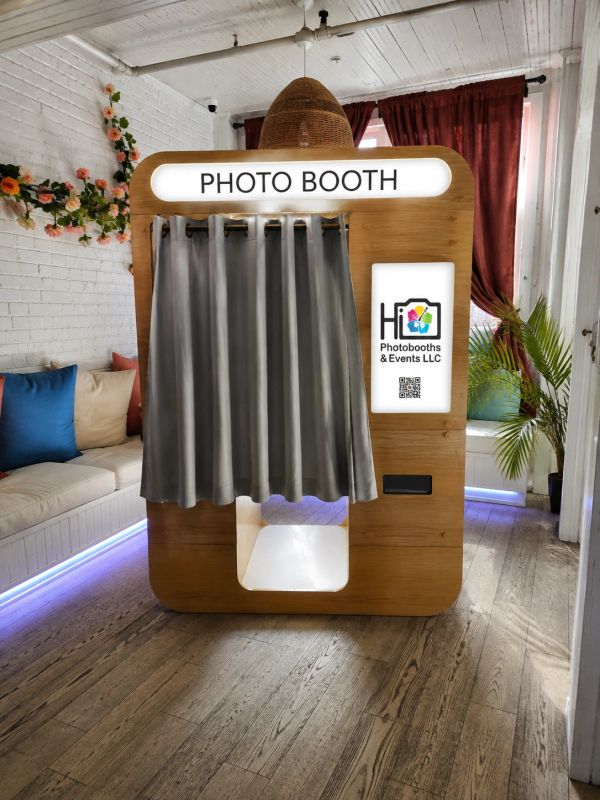 Photo booth with curtains in a cozy room.