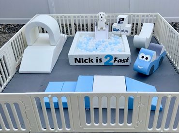 2 Fast, second birthday soft play outdoor setup. Ball pit and soft play toys.