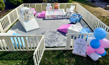 A colorful and safe outdoor play space with soft play toys for sliding, climbing, and exploring for toddlers. Two Sweet theme.
