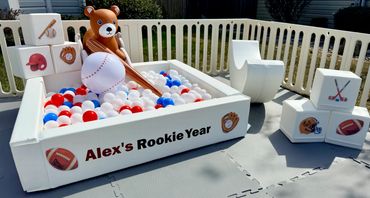 Rookie year birthday theme. Up close picture of ball pit and themed building blocks.